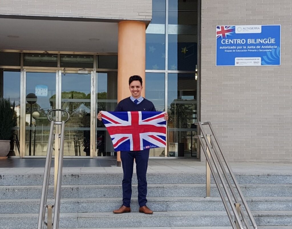 Myself with the British flag in the school entrance