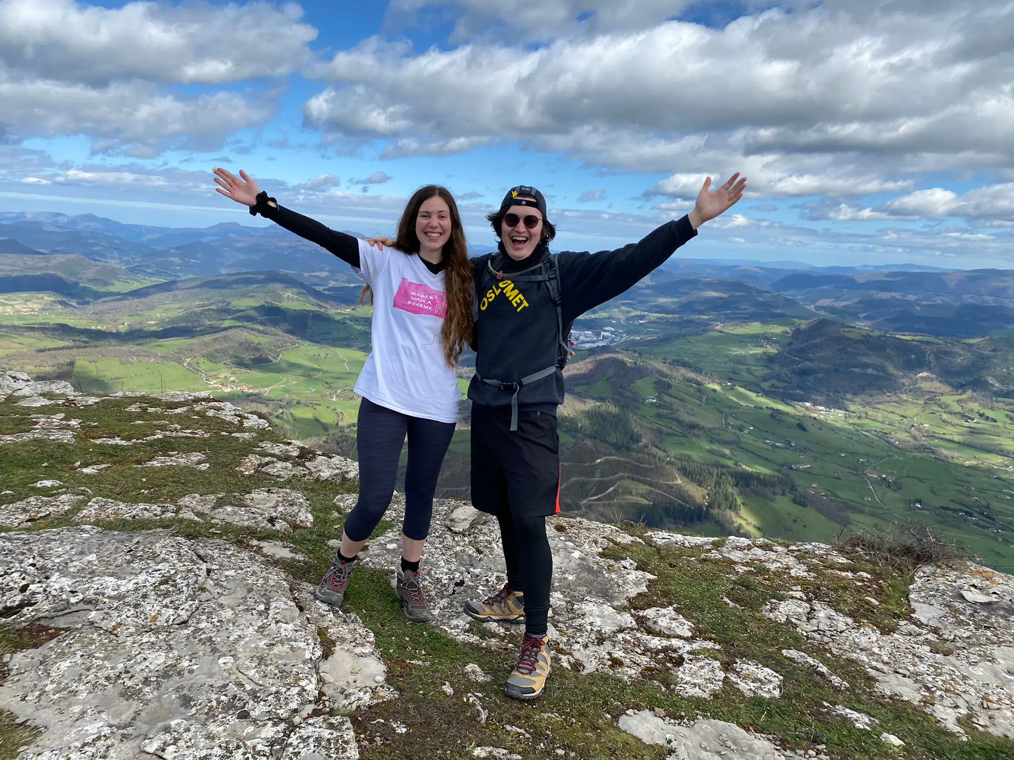 two friends on the top of a mountain in Spain