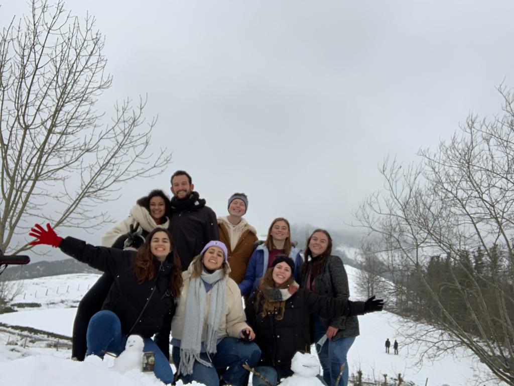 group of friends in the snowy mountains of northern Spain