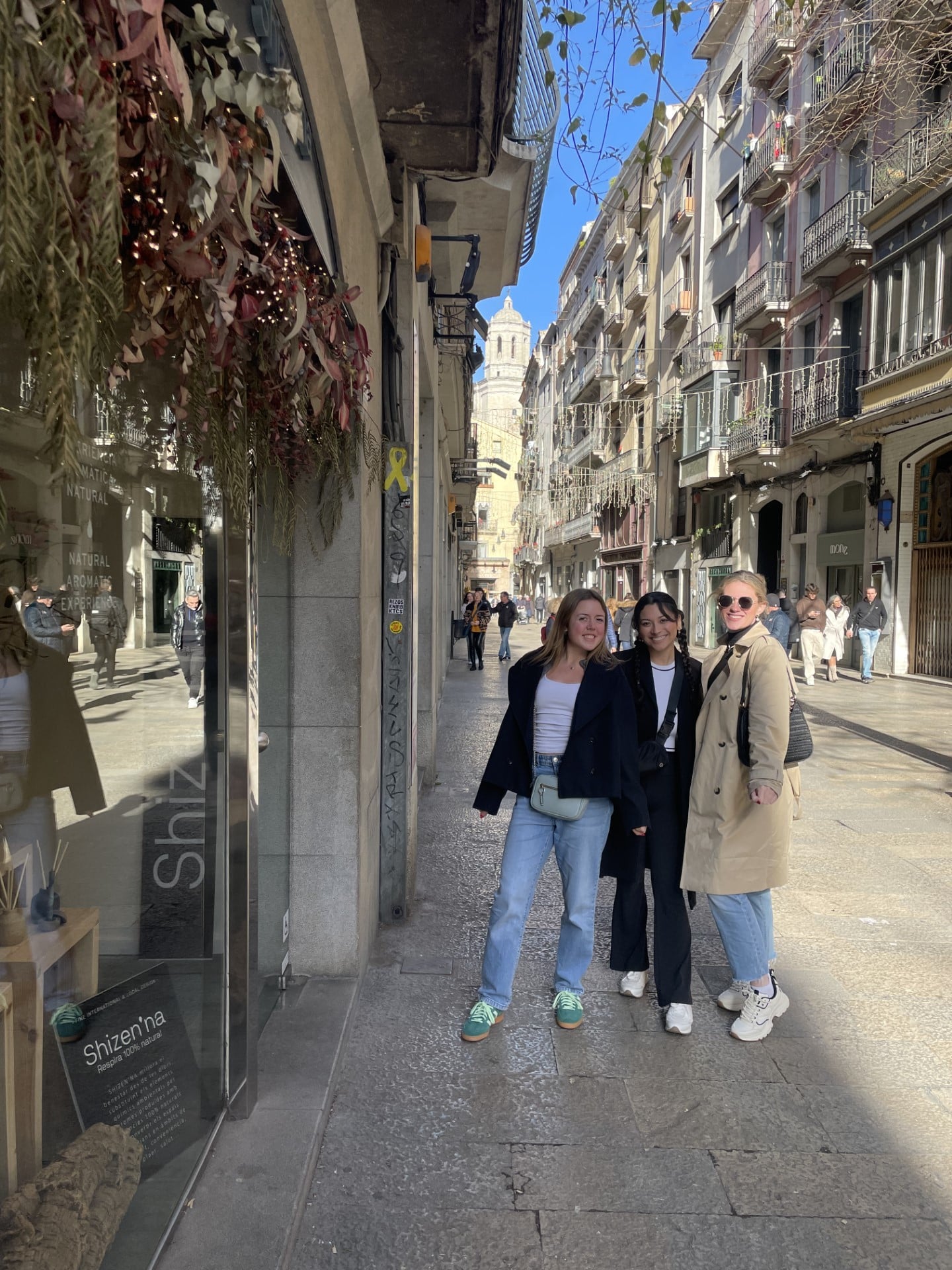 Author standing, posing with friends, in Barcelona